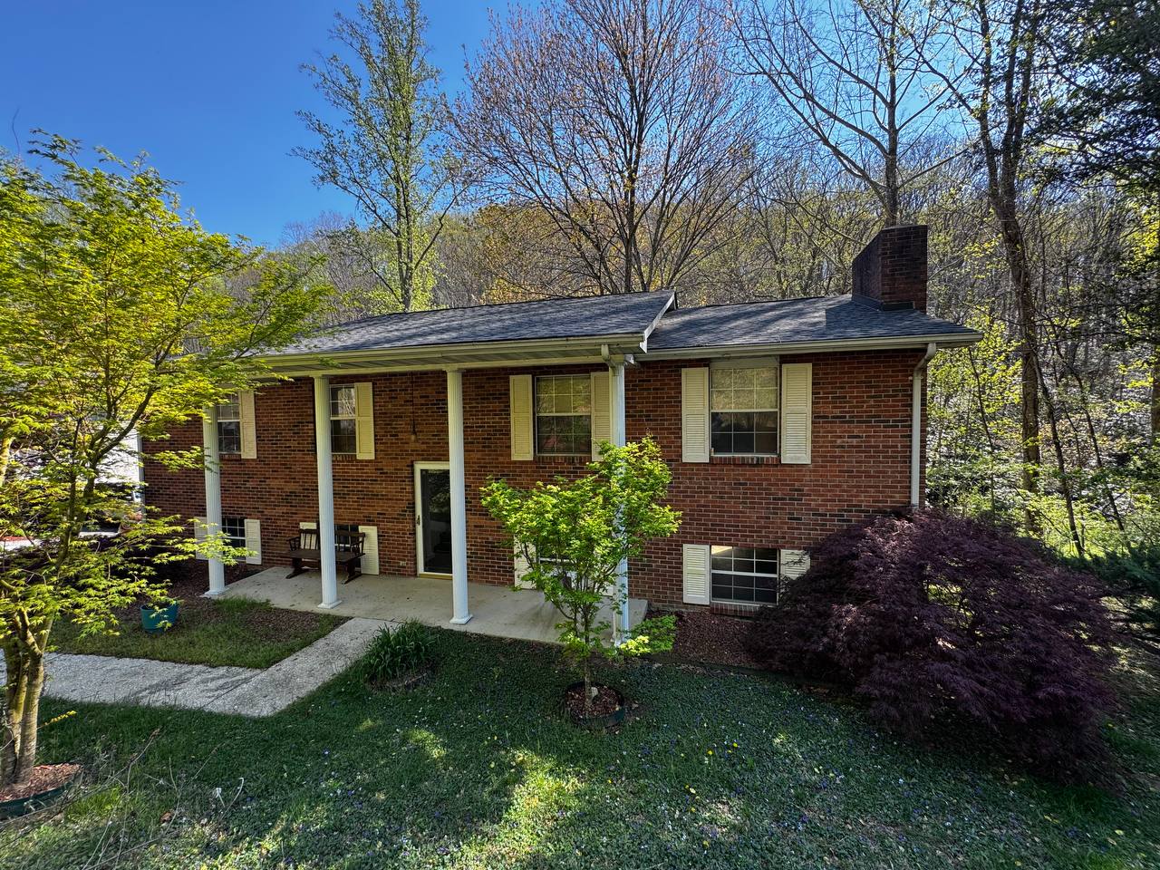 Brick split-level home near Hendersonville, NC that we bought before a foreclosure auction
